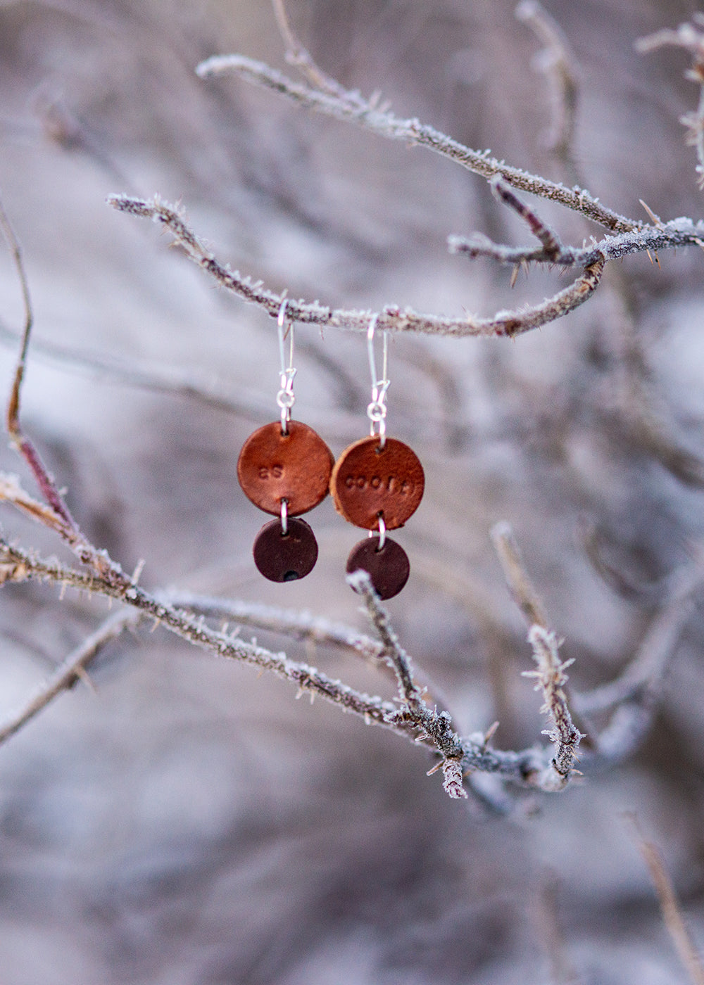 Light weight leather earrings "as coolt"